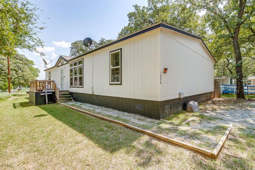 Welcome to 1804 Coral Rd! 
Built in 2021, this beautiful manufactured home in Azle ISD offers 4 bedrooms, 2.5 baths, and a smart layout designed for comfort and convenience.
The open-concept design features a spacious living area and a chef’s kitchen with an oversized island perfect for family meals, entertaining, or working from home. The Jack & Jill bath connects two secondary bedrooms, while the fourth bedroom offers flex potential as an office, playroom, or guest space.
The primary suite is a retreat with dual walk-in closets, a soaking tub, and a separate shower. Guests will appreciate the additional half bath.
Enjoy modern finishes, a functional layout, and all the space you need, just minutes from schools, shopping, and Eagle Mountain Lake.

Don’t miss this move-in ready home in desirable Azle ISD!