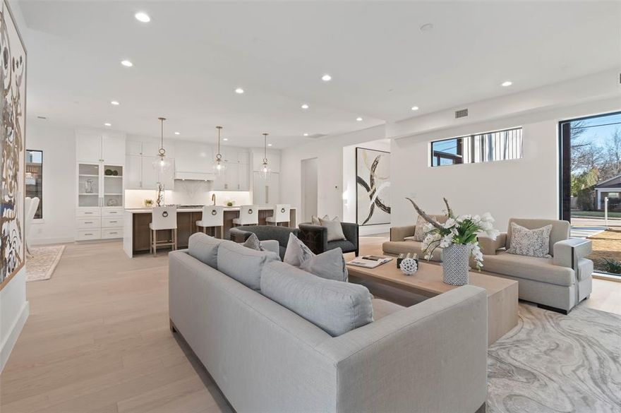 Modern living in this three-story Preston Hollow residence is proof you really can have it all! Bursting with sophistication, this gem displays an open transitional-style interior with fine finishes, wide-plank wood flooring, high ceilings, and custom built-ins. Unwind by the living room’s stacked-stone linear fireplace before savoring meals under the dining area’s elegant chandelier. An avid cook’s dream, the gorgeous kitchen features premium appliances, shaker-style cabinetry, a pantry, and sleek quartz countertops extending to the waterfall island. End the day in the comfortable retreats accommodated by impeccably tiled baths. Outdoor entertaining on the 2nd floor patio with outdoor fireplace. The upper-level features vaulted ceilings, a picturesque window wall, and a generous open entertainment area with a kitchenette, ensuite bedroom, and a home office. With shopping, dining, and top private schools nearby, why wait?