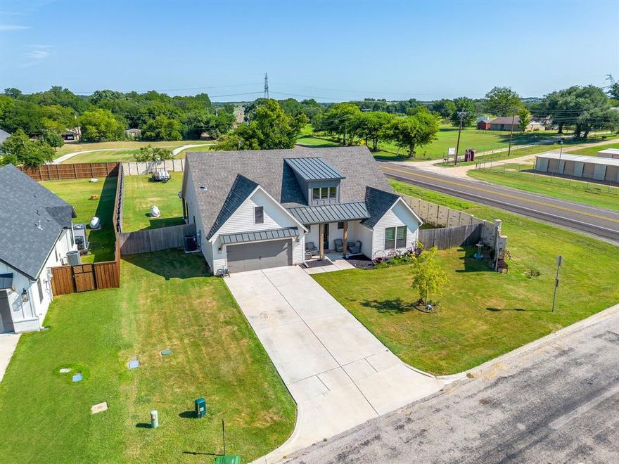 This 4 bed 2.5 bath modern farmhouse has classic elegance. Board and batten siding gives it great curb appeal. The
 4th bedroom or optional study or playroom is conveniently located behind the kitchen and next to the powder
 bathroom. The Great Room has 10' ceilings and a ledger, stone marble fireplace with gas logs and is open to the
 kitchen and dining area. The gourmet kitchen features a six burner gas range, large prep island with seating for four,
 and is open to the dining and great room. The restful master bedroom is situated on the right side of the home, away
 from the other bedrooms, and boasts 10’ ceilings, large walk-in closet, a master bathroom with a large Shower and a
 free-standing tub. The secondary bedrooms share a full bathroom and plenty of closet space. A
