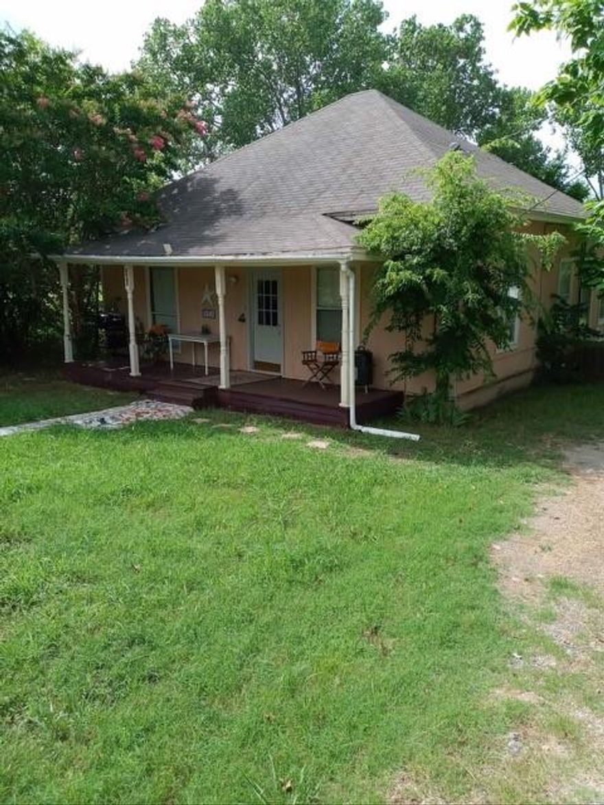 Nestled in the heart of one of the nation's fastest-growing cities, this charming older frame home offers a unique blend of character, history, and opportunity. With classic architectural details and a welcoming front porch, this home exudes warmth and nostalgia. Its solid frame construction provides a sturdy foundation, to enhance its timeless appeal. Situated in a rapidly expanding community, this property enjoys proximity to thriving businesses, entertainment, and modern conveniences. Whether you're looking to its original beauty, modernize its features, or invest in a prime location, this home presents endless possibilities. Home has a large yard to hold family gatherings. From the front door walk into the living room, with Jack-n-Jill bathroom. Open kitchen that can be closed off with a door. The 3rd bedroom off the kitchen along with laundry room and 2nd bathroom on the other side of the kitchen. An extra space that is made into a wash area. NO HOA Close to downtown Princeton to restaurants and workout spaces. This home can be used your home or an office space. Lots of potential!! Don't miss your chance to own a piece of history while embracing the future of this dynamic city!