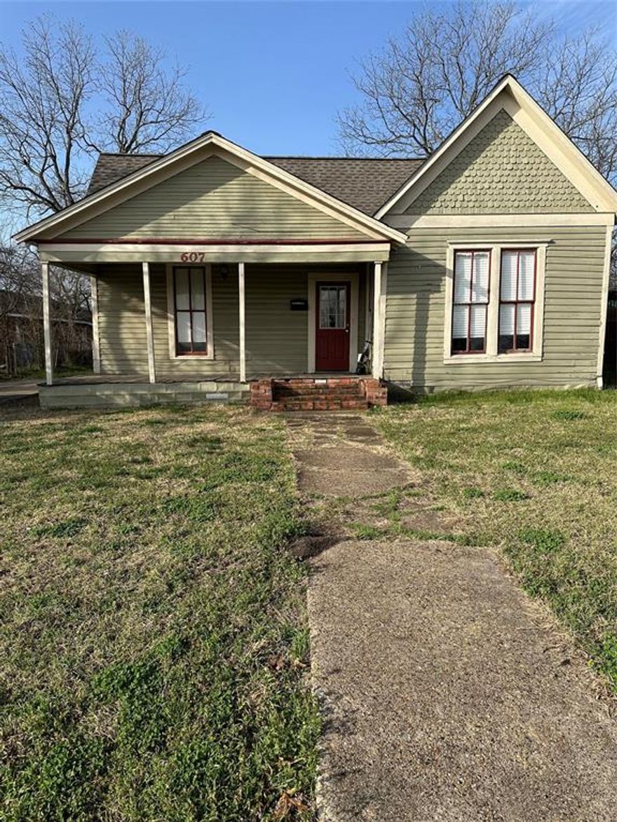 This home is centrally located near the new Downtown Ennis area.  Walking distance to the dog park, shopping, and restaurants.  Located in the Historical District.  Home has been a lease property for several years, and can continue.  Floors are wood, tile, and carpet.  A large backyard with roo for expansion.  Front porch is large enough for table and chairs.  No survey is available, this will be a buyer's expense.  Repairs needed.  Selling as is.  Please use Town Square Title in Midlothian.