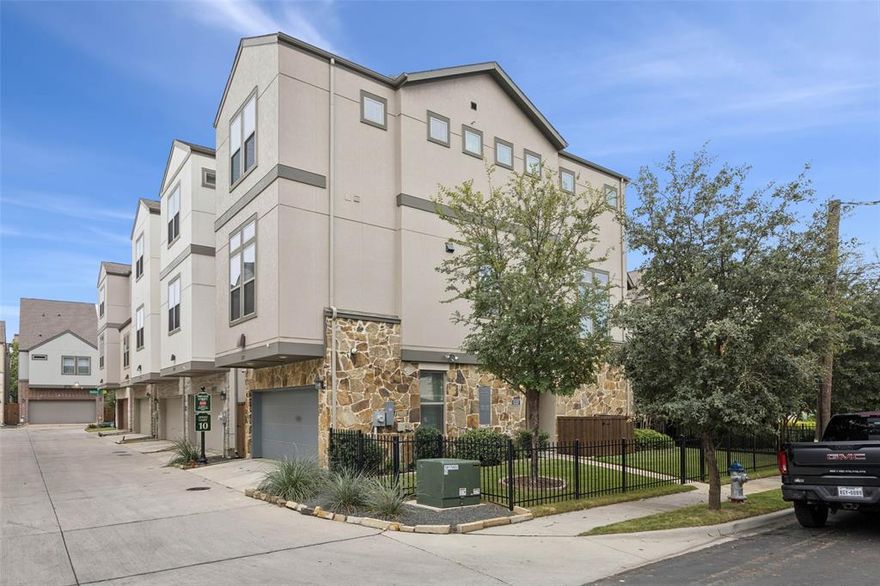 Immaculately maintained and architecturally striking, this 2021 David Weekley home represents an elevated standard of living within the Cityville zero lot line collection. The vertical design maximizes space and light, starting with a practical first-floor guest suite or office, entry foyer, and two-car garage. The entire second level is a statement in open-concept luxury, featuring a gourmet kitchen, sun-drenched dining area, and spacious living room. Every detail—from the high-end appliances to the custom cabinetry and elevated finishes—has been carefully selected. The entire third floor is dedicated to rest and retreat. The luxurious primary suite offers a serene escape, complete with dual separated closets and a lavish bathroom featuring a deep soaking tub, separate frameless glass shower, and chic dual vanities. Uniquely positioned as a corner unit, this property boasts an exceptional bonus: a significantly larger, fully fenced yard, offering a genuine outdoor extension of the home. This is sophisticated, urban living delivered with a single-family feel.