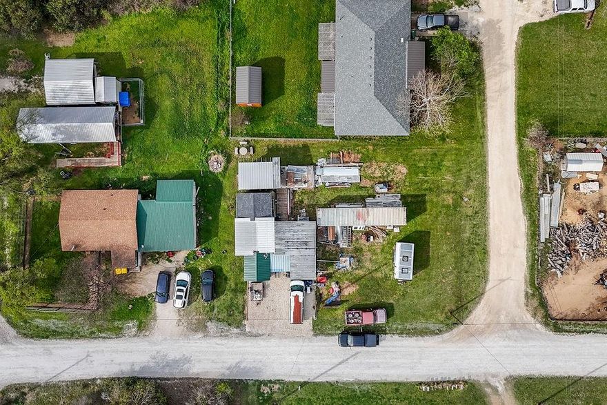 Cozy 2 bedroom 1 bath home with unique rustic charm situated on a corner lot outside the city limits in Whitney, TX. This property is conveniently located close to town and Lake Whitney. There is an additional room or storage in the back that you can add electric to and it can be easily converted to a mancave, she shed or whatever you desire.