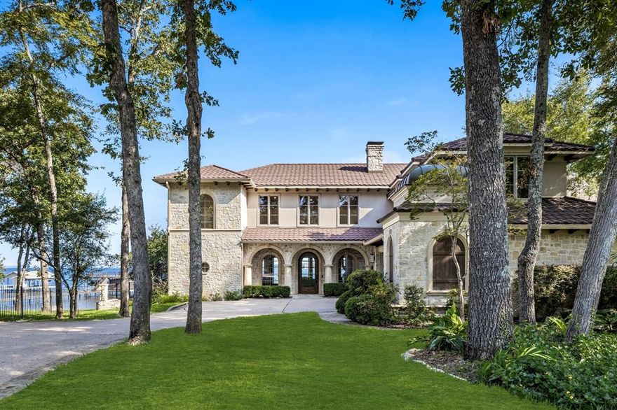 Experience unparalleled lakeside luxury at its finest! This stunning 6-bedroom, 6.5-bathroom retreat, complete with a 3-car garage, is situated on 2 prime lots along Cedar Creek Lake (SALE INCLUDES LOT NEXT DOOR) and stands as an architectural marvel. Completely updated in 2022 and 2024, this home features a state-of-the-art media room, a sophisticated wine cellar-bar, and dual indoor-outdoor fireplaces for year-round enjoyment. The gourmet kitchen is a chef’s delight, equipped with a 6-burner stove and elegant column refrigerator.  Step outside to discover your private oasis—a sprawling outdoor living area with breathtaking lake views. The expansive boathouse, constructed with low-maintenance composite materials, includes a boat lift with a touchless cover and 4 sea doo lifts. Envision serene sunsets, exhilarating lake activities, and luxurious living in every detail. Seize this extraordinary waterfront gem today and embrace the ultimate lakefront lifestyle. Your dream home awaits!