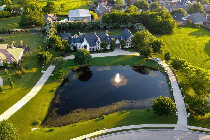 A truly exquisite estate on 2.5 acres in the highly desirable Hills of Buffalo Creek. A circular drive surrounds the beautiful aerated pond. This 5-bedroom, 9-bathroom home has undergone over $200k in renovations in recent years, including new wolf appliances, updated hardware and granite countertops in the kitchen, new windows, flooring, fixtures, paint, and wood trim throughout. The main floor features the owners' suite, a second bedroom with full bath, a study, two living areas, kitchen, dining, breakfast area, wet bar, three fireplaces, and a utility room. The second story includes three bedrooms with private baths, a media room with a kitchenette, and a spacious game room with a full bath. The backyard is a resort-like oasis with an outdoor kitchen, diving pool and jacuzzi, cabana with bath and changing area, wood-burning fireplace, remote screens, and hvac. The four-car garage includes a half bath. This home is move-in ready! Luxury awaits at 1704 Bison Meadow. Excellent location with easy access to retail and restaurants. Rockwall is a premier lakeside community just east of Dallas. Schedule your showing today!