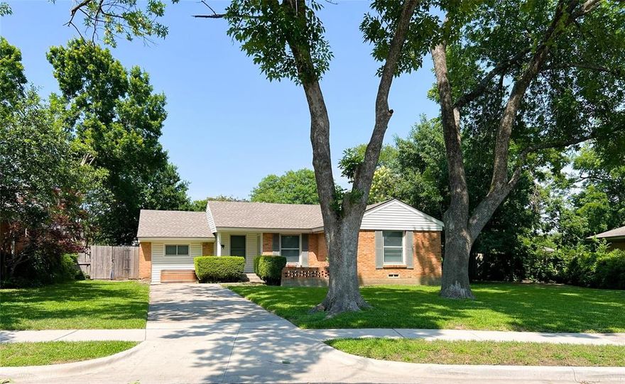 Charming 3-Bedroom Home in Old Lake Highlands. Nestled in the highly sought-after Old Lake Highlands neighborhood, this light-filled 3-bedroom home combines comfort, character, and convenience. Surrounded by mature trees and set on a spacious lot, it offers a warm, open layout ideal for small families or remote work setups. Inside, you’ll find hardwood floors throughout the living areas and bedrooms, an abundance of windows that fill the home with natural light, and generous built-in storage including cabinetry in the utility room. The newly updated bathroom features a clean, modern design, while the kitchen is outfitted with quartz countertops and comes fully equipped with a range, refrigerator, and microwave. A full-sized washer and dryer are also included and in excellent condition. Step outside to enjoy a spacious backyard with a storage shed and a cozy front deck perfect for relaxing with a morning coffee or visiting with neighbors. Located just minutes from White Rock Lake, Casa Linda, SMU, and the Dallas Arboretum, with downtown Dallas only a 20-minute drive away, this home puts natural beauty and city amenities right at easy access.