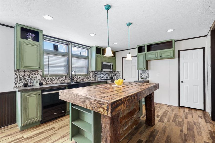 Discover this beautifully renovated 3-bedroom, 2-bathroom home nestled on a desirable corner lot. The circular driveway provides ample parking space and adds a touch of elegance. Step inside and be greeted by a warm and inviting atmosphere. The updated rustic color scheme creates a cozy and stylish ambiance. The spacious bedrooms offer plenty of room for relaxation, while the modern bathrooms feature contemporary fixtures. The home's convenient on-site storage provides ample space for your belongings. Enjoy the privacy and convenience of a corner lot, with plenty of room for outdoor activities or gardening. Don't miss this opportunity to own a beautifully renovated home in a prime location. Schedule a showing today!