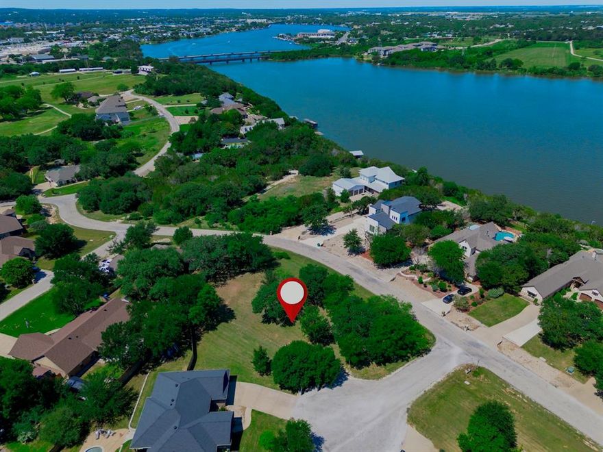 A MUST SEE!!! This premier 0.52-acre corner lot in Lakewood Hills Estates offers a rare opportunity to build a custom legacy home in one of Granbury’s most tranquil and established neighborhoods. Situated on a quiet cul-de-sac and surrounded by mature trees, this property sits directly across from million-dollar lakefront homes, giving you the wide-open space for a private retreat with the prestige of a high-end residential community. Enjoy an unbeatable location just steps from Granbury Country Club, with Lake Granbury and a public boat ramp only minutes away—perfect for golf, boating, and lakeside living. Conveniently located near shopping and dining, the lot is also close to Granbury City Beach Park, Hood County Fair Grounds, and the Historic Granbury Square. The scarce acreage is exceptionally prepared for development, with a professional survey and architectural drawings available upon request.