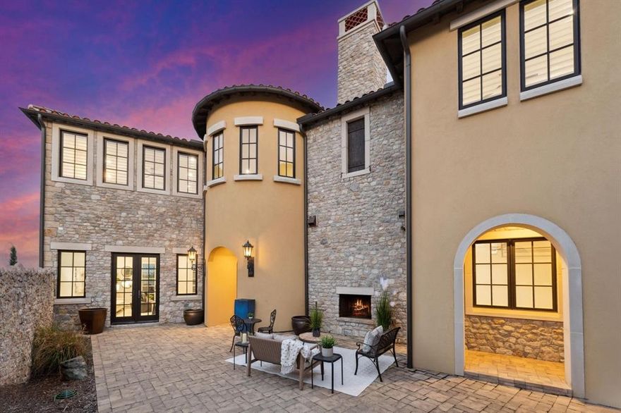 Spanish Catalonian waterfront masterpiece, nestled in distinguished Westlake Entrada. The intimate stone courtyard with fireplace welcomes you. Once inside, enjoy a sunlit living space, pristine wood floors, chic fireplace, and expansive French doors that present beautiful canal views. Open kitchen with  granite island, Wolf and Subzero appliances and striking designer elements make every meal an event. Venture upstairs to a spacious game room with bar. The primary suite is a haven, complete with a serene tub, rich granite vanities, exquisite finishes and expansive custom closet. Two private bedrooms have en-suite baths, utilize the adaptive fourth bedroom for work or recreation. Step outside to the impressive canal-front patio and lawn, a front-row seat to nature's tapestry during twilight. Stroll to shops, coffee houses, and walking paths with canal views. Deep dive into unparalleled sophistication, where every day is infused with lock & leave convenience. Enjoy nearby Westlake Lifetime Fitness less than 1 mile, Southlake Town Square and easy access to DFW Airport. Carroll ISD or Westlake Academy school options.