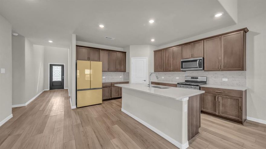 Corner lot living meets everyday luxury in this Kessler plan by Meritage Homes, giving every member of the household room to breathe, connect, and enjoy being home. Step inside and feel it right away. The open-concept layout flows naturally from the kitchen through dining and into the main living space. Mornings have a rhythm of their own. Sunlight pours through energy-efficient windows while coffee brews, kids grab a quick bite at the oversized island, and the family moves through the day with ease. This kitchen was built for real life, from casual Tuesday dinners to holiday gatherings where everyone ends up right where the action is. The downstairs primary suite is your personal retreat. Dual sinks, a generous walk-in closet, and just enough separation to feel like your own private corner of the world. A 2nd BR or home office on the 1st floor adapts to whatever life needs right now. Head upstairs and the game room becomes the heartbeat of the home. Movie nights, tournaments, weekend hangs, it handles it all. Three additional BRs offer space for family, guests, or hobbies. Smart home tech keeps climate and security in check, and the corner lot gives you breathing room you notice every day. Palmilla Springs offers walking trails, a playground, and a dog park, plus quick access to Uplift Elevate Preparatory, Lockheed Martin, downtown Fort Worth, and DFW Airport.