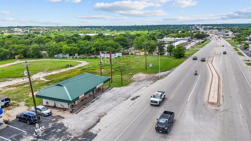 Seller will entertain all decent offers. Great commercial location this property is currently leased for retail and can be split for new construction with approximately 2 acres to build on with access from Fort Worth Hwy and Allen St. located next to the lumber yard.