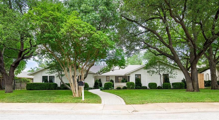 SHOWINGS START TUESDAY! Tucked in the heart of the Private School Corridor on an expansive one-third acre lot, this exquisitely reimagined mid-century ranch has been taken to the studs and rebuilt by Par Capital Investments in collaboration with AU Designs. The façade remains timeless, defined by original chiseled brick and a French Limestone wall, offering a refined first impression with a modern edge. The 4-bedroom, 3.5-bath layout includes a private study and is elevated by 9-foot ceilings, wide-plank white oak flooring throughout, and gallery-smooth Level 4 wall finishes. The kitchen is a true showpiece, featuring a professional-grade six-burner range and premium appliance package. A dramatic marble backsplash extends to the ceiling, complementing Taj Mahal quartzite countertops with a sculptural mitered edge and custom white oak shelves. The sink overlooks the backyard, allowing the expansive island to remain uninterrupted—ideal for entertaining. The primary suite offers a spa-like retreat with Calacatta marble mitered edge countertops and refined finishes that embody modern luxury. Outdoors, the backyard presents a private oasis centered around a 10-foot-deep diving pool with new plaster, coping, tile, decking, and a brand-new filtration system. Professional landscaping, three new French drain systems, and a new irrigation system enhance both beauty and functionality. Backing directly to Peter Pan Park, the home enjoys peaceful, tree-lined views and exceptional privacy, complemented by a new 8-foot Japanese cedar fence. Comprehensively upgraded, the home includes a reinforced foundation, all-new plumbing and electrical systems, and premium Sierra Pacific aluminum-clad windows and doors, all backed by transferable warranties. Ideally located in Dallas’ private school corridor and zoned to Withers Elementary, with premier dining, shopping, and conveniences just moments away.