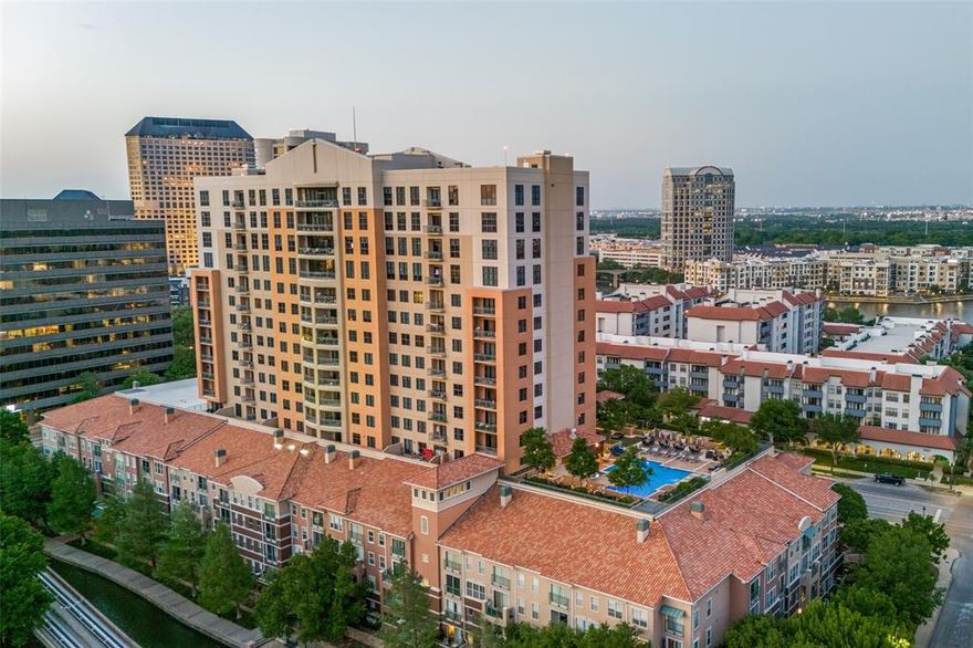 Rarely does an end-unit condo on a high floor become available with such an extraordinary mix of features: panoramic views; a private balcony; hardwood floors; granite countertops; and an open floor plan designed for both grand entertaining and intimate relaxation.Large windows allow natural light to pour in, accentuating the room’s freshly-painted neutral palette & hardwood floors.Primary bedroom has ample room for a king-size bed, nightstands, & a reading nook beneath the window with the breathtaking views. Large walk-in closet is located in en-suite bathroom with dual vanities and a soaking tub.Second bedroom is awash with natural light and the same wonderful views. Hallway bathroom adjacent to secondary bedroom has granite countertops and a combination bath & shower. With views and amenities like this guests may never want to leave.Private balcony with room for a bistro set or lounge seating extends your living space & invites al fresco dining, stargazing, or simply moments of quiet reflection. Unobstructed 180-degree views of Las Colinas’s tree-lined streets, the serene expanse of Lake Carolyn, & soaring towers of downtown Dallas all within 12-minute drive to DFW airport & 15 to Love Field. Resort-style amenities, 24-hour concierge service, rooftop pool, fitness center, executive conference room, coffee lounge & secure parking. Walking distance to Water Street & Toyota Music Factory. One of DFW's most convenient locations facilitates commuting to Dallas, Fort Worth & surrounding areas with proximity to 5 easily accessible highways.