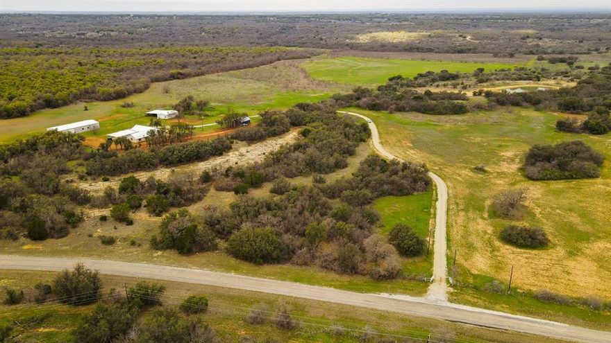 PRICE IMPROVEMENT! The Half Hoof Ranch has approx 642 acres in both Stephens and Eastland Counties. The land offers varying terrain and panoramic views with around 100 ft of elevation changes. Hardwoods, plum thickets and mesquite envelope the property. Klein and native grasses are in good shape. Multiple ponds and watershed creeks supply water for livestock and wildlife. Wildlife is in abundance and Half Hoof has seen very limited hunting. The 3,000 sq ft main home has 2 bedrooms, 2 baths. The great room includes the living room with a free-standing wood burning stove, dining room. and kitchen, encompassing approx. 1,215 sq ft! Perfect for a spacious home, corporate retreat or hunting lodge. The 3,600 sq ft shop has a concrete floor, a roll-up door, a sliding door, a walk-in door and 110v electric. The 1,200 sq ft shop also has a concrete floor, 110v electric, rollup doors and a walk-in door, and a 40'x40' outdoor stall area.