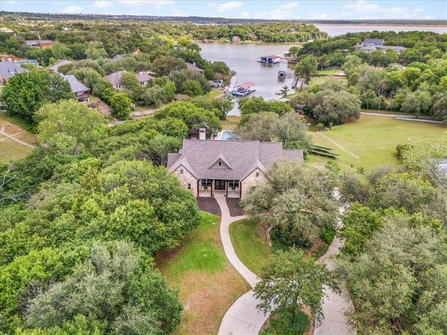 Situated on 3.6 beautifully treed waterfront acres, this incredible Eagle Mountain Lake property offers a rare combination of privacy, space, recreation, and lakefront living. The main home features 4,126 square feet with 4 bedrooms, 4 full bathrooms, a dedicated office, spacious gameroom, theater room, swimming pool, and a layout designed for both everyday living and entertaining. In addition, the property includes a 432 square foot mother-in-law suite, giving flexibility for guests, extended family, or additional living space.

The waterfront setup is truly exceptional, featuring a private dock with jet ski lifts located on one of the deepest sloughs on Eagle Mountain Lake, with nearly 9 feet of water depth when the lake is full. Enjoy quick access to boating, fishing, and watersports while being just minutes from the nationally recognized Fort Worth Boat Club, local lakefront dining, shopping, schools, and so much more.

Brand-new roof and gutters installed in May 2026! Everything in the house is negotiable — including the vehicle and boat. Having solar panels and a wind turbine helps keep electric bills extremely low, typically around $100 per month. Storage shed also on the property!

This is a rare opportunity to own an amenity-packed waterfront estate on Eagle Mountain Lake, offered at $1,999,000.