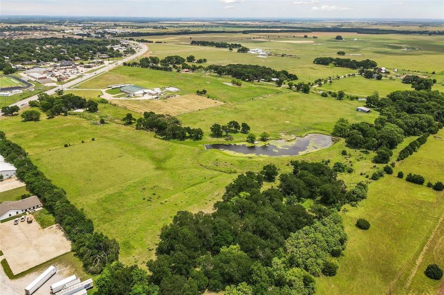 Nestled strategically with 2,048 sq ft of highway frontage, this sprawling 106.4 acre property presents a unique investment opportunity ideally located just minutes from the Dallas North Tollway. Offering a versatile landscape that supports both commercial and residential development, this estate combines robust infrastructure with vast, open spaces. This estate offers 3 single family residences 3,682 sq.ft home, a 2,698 sq.ft home, and a 1,636 sq.ft home. At the heart of the estate lies a substantial 21,415 sq.ft commercial building. Equipped with offices, laboratory, multiple greenhouses, and a large conference room, this facility is primed to host a corporate headquarters, medical facility, or research center. Water & Sewer are available onsite. Property is enjoying an agricultural exemption. Whether considering developing exclusive residential estates, a commercial complex, or a mixed-use development, this property provides a canvas for a visionary investor. Endless possibilities.