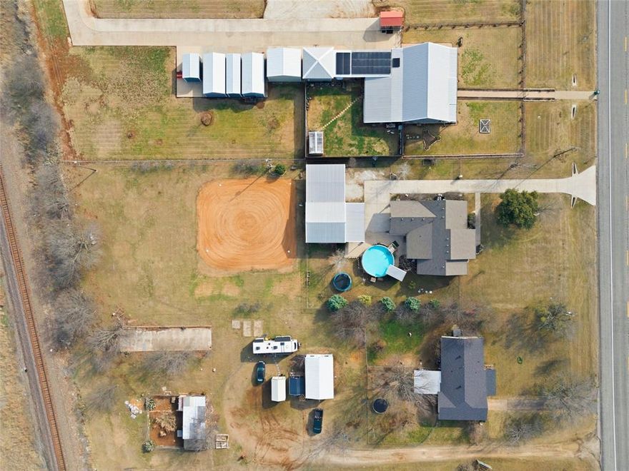 Vacation style living at home!
This 1 acre property is made for entertaining with two hangout spaces, an above ground pool, and a backyard baseball field perfect for making memories!!

Inside the main home you’ll find 4 bedrooms, 2 baths, and a dedicated office, plus a living area with built-in shelving and hand scraped vinyl wood flooring. The kitchen features granite countertops, a farmhouse sink, and a large island ideal for everyday living.
The private primary suite offers a walk in closet, dual vanities, and a walk in shower. Outside, a covered patio leads to the pool and a separate shop structure with a bonus flex room, ideal for a game room, hobby space, or additional storage, all conveniently located about a mile from the heart of McGregor.