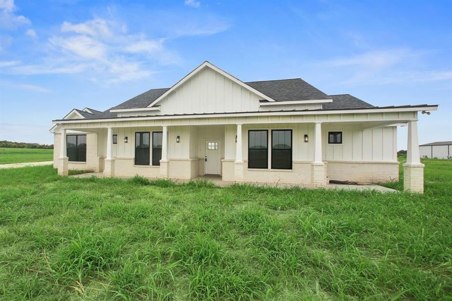 This brand-new, custom ranch-style home offers 3 bedrooms, an office, and a versatile flex room on 3.1 acres, with up to 6 additional acres available for purchase. Designed with thoughtful details throughout, the home features a spacious primary suite with a walk-in closet that includes washer and dryer hookups, along with a separate full laundry room on the opposite side of the house. The open layout was built with convenience in mind, including intentional outlet placement and flexible spaces to suit any lifestyle. Enjoy the expansive covered back patio for outdoor living and entertaining, all while surrounded by the beauty and privacy of country living in a timeless ranch-style elevation.