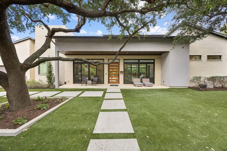 Contemporary, one-of-a-kind architecture meets sophisticated luxury living all on one floor. This stunning custom home is designed for exceptional living, with every feature carefully selected for beauty, functionality, and effortless entertaining. Defined by sleek lines, expansive windows, dramatic sliding doors, high ceilings with LED accents, and an elegant mix of premium finishes, the residence exudes modern elegance. The open floor plan is drenched in natural light, framing captivating views of the resort-style pool and impeccably landscaped grounds. The gourmet kitchen is a showpiece, offering a white oak rift cabinets, Bellagio Quartize counter tops, a generous eat-around center island, Kitchen Aid appliance package; double ovens, 2 dish washers, microwave, refrigerator and gas range. Flowing seamlessly from the kitchen, the great room dramatically features a backlit onyx fireplace, bar with wine fridge and cabinets, 109” retractable TV projector, and oversized multi-slide glass doors that lead to the screened in outdoor living room and poolside retreat. The great room and primary suite both open to a private backyard oasis with low-maintenance artificial turf throughout front and backyard with oversize walking pavers, 2 covered lounge area, and a sparkling pool—perfect for year-round outdoor enjoyment. The luxurious primary suite offers tranquil views of the pool and spa. Its spa-inspired bath includes dual vanities, a freestanding soaking tub, a oversized walk-in shower, and a custom-designed walk-in closet. Additional amenities include a versatile office plumbed for 4th bedroom, a generator, heaters on covered screened in patios, owned solar panels, extra parking for RV or Boat, a putting and chipping green and automatic gate for front garage entry. All you could ever dream of on one floor. Privacy, tranquility and well-appointed floor plan and textiles make this residence as functional as it is breathtaking.