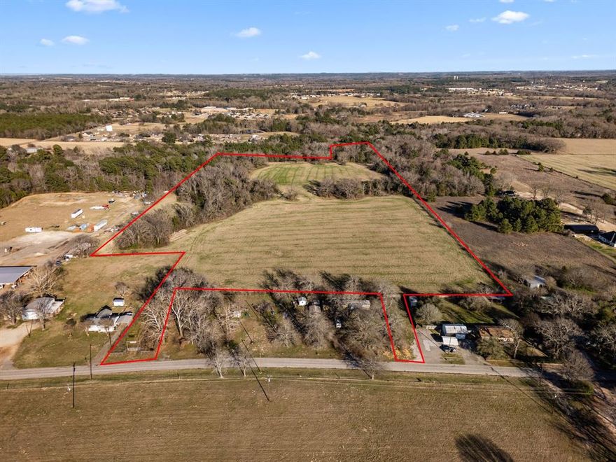 13.8 acres track to be divided out of 27.5 acres track. Two 13.8 acre tracts available or total of 27.5 acres all together. $35,000 per acre. Gorgeous 27.5 acres of raw land less than 5 mins from Lindale Junior High in LISD.  Has small pond on property. Flat, Perfect for residential housing development or private small ranch. Currently no restrictions but future deed restrictions to be negotiated. If 27.5 acres purchased all together, no restrictions.