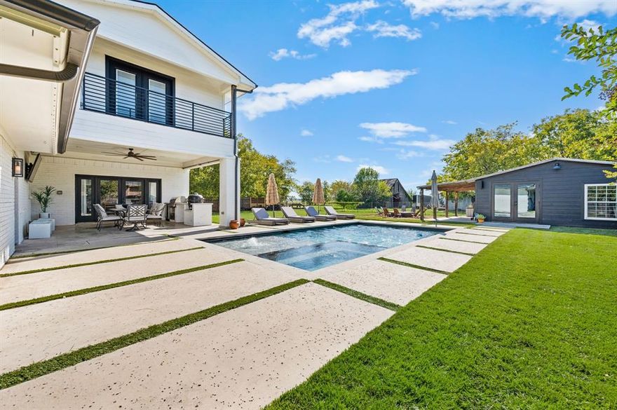 Welcome to this beautiful modernized ranch-style home, perfectly situated on over a third of an acre, in one of the area’s most desirable towns; Roanoke, the Unique Dining Capitol of Texas. Completely Remodeled with new addition in Feb. 2019. This home features 4 bedrooms, 4 bathrooms and combines classic charm with contemporary elegance for the ultimate in comfortable living. Step inside to discover a thoughtfully updated interior with light-filled living spaces and an open-concept layout ideal for entertaining. The large kitchen flows seamlessly into the living and dining areas, making it perfect for both everyday life and special gatherings. Venture outdoors to experience resort-style living at its finest. Host unforgettable get-togethers in the outdoor kitchen, relax in the sparkling heated pool, roast marshmallows in the built in fire-pit, or celebrate in the expansive party barn—ideal for everything from milestone events to casual evenings with friends. The Party barn offers an additional 550 square feet of lounge and entertaining space. House also has built in LED Christmas lights with multiple color options. Enjoy the convenience of a walkable lifestyle, with popular restaurants and live entertainment just steps from your front door. This property offers the rare combination of modern amenities, generous outdoor living, and unbeatable location—don’t miss the opportunity to make it yours and Ring in the New Year!!