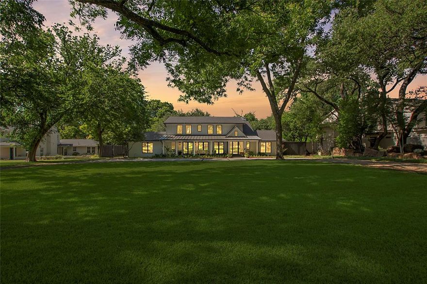 Griffin Creek Retreat – Where Charm Meets Quality Craftsmanship
This spacious, modern farmhouse—originally built in 1959 by the matriarch of the Griffin farm—has been luxuriously reimagined with inviting outdoor living spaces and timeless style. Located on 0.82 acres backing to a spring-fed, year-round creek, it offers a
peaceful retreat steeped in history—just minutes from the heart of Dallas.  Every detail has been thoughtfully curated with high-end materials and finishes, including quartzite and marble stone, rich hardwoods, lush landscaping, and premium stainless steel appliances: Sub-Zero, Bosch, and Scotsman. The result is a refined and stylish and livable home designed for comfort and entertaining.  A grand 12-foot-deep front porch sets the tone—perfect for morning coffee, evening cocktails, or watching local wildlife while connecting with neighbors.  The covered back porch overlooks a sparkling pool and spa, complete with an outdoor TV and serene views.  Down the gently sloping backyard, a custom fire pit beside the creek creates the
ultimate space for gatherings under the stars.  This home isn’t just a place to live—it’s a way to live. A rare blend of craftsmanship, comfort, and character.  Schedule your private tour today and experience one of Dallas’s most stunningly rebuilt properties.