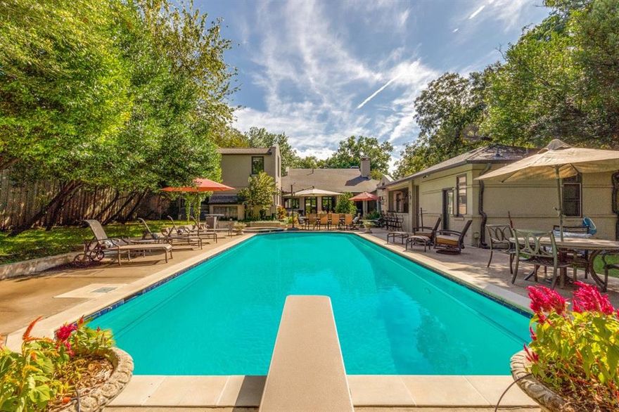 Remarkable Value in Forest Hills. Luxury meets versatility in this must-see transitional contemporary estate on a half-acre+ in Forest Hills, designed by Chase Coker. Featuring designer selected fresh paint inside and out, 4 bedrooms, 5.1 bathrooms, and an open floor plan that adapts to various life stages.
Designed for mostly single-story living, this estate includes a private guest suite on the second floor that offers flexibility to suit your needs, making it perfect for a gym, home office, mother-in-law suite or nanny accommodations. The newly remodeled gourmet kitchen boasts a 48” La Cornue range, a 9-foot black leathered marble island and a custom wine room overlooking a resort-style pool with fountains and bench seating. The first-floor primary suite serves as a private retreat, complete with a veranda overlooking the grounds. A dedicated pool bathroom with a dry sauna adds convenience and luxury. 
Rich wood and stone floors, grand built-ins, designer lighting, three-car garage behind electric fence and Sonos surround sound throughout complete this exceptional home designed for living your way. Situated in a close-knit community with an active and voluntary HOA, residents enjoy neighborhood events and special interest clubs for everyone from auto enthusiasts to nature lovers. This home also offers the privilege of proximity to White Rock Lake—featuring a sprawling urban park where one can experience nature in the heart of the city—and the Dallas Arboretum. Additionally, there is a spectacular security patrol, ensuring peace of mind in this beautiful and engaged community minutes from the Downtown Business District and Baylor Hospital Complex.