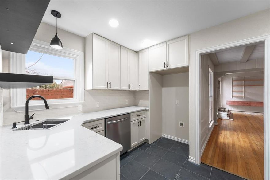 311 N Tennant Street offers a rare blend of timeless North Oak Cliff charm and thoughtful modern updates, set on a spacious 6,477-square-foot lot just minutes from Bishop Arts, Stevens Park Golf Course, and some of the area’s most loved dining and coffee spots. Inside, natural light moves easily through the home, highlighting original character elements alongside a full remodel completed in the summer of 2025, designed to enhance both comfort and functionality. The kitchen and living spaces feel open yet intentional, ideal for everyday living and easy hosting, while the bedrooms provide quiet retreats at the end of the day. A prestine Dale Beck inspired fireplace. Major improvements include a new roof, new HVAC system with all new ductwork, a tankless water heater for on-demand efficiency, and a Nest thermostat that brings smart climate control into daily life. A one-car garage adds convenience, while the backyard offers space to relax, garden, or gather, creating an extension of the home’s livability. Located in one of Dallas’ most established and character-rich neighborhoods, this home delivers the balance of community, accessibility, and modern peace of mind that today’s buyers value. Schedule a showing to experience the flow, warmth, and lifestyle this home offers in person.