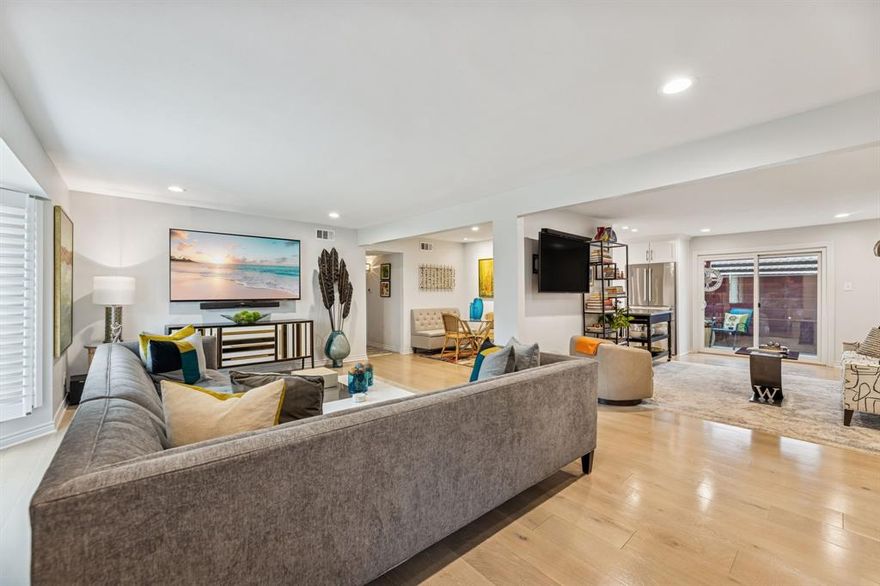 Refined luxury defines this fully renovated 2-bedroom, 2-bath residence (approx. 1,329 sq. ft.) with two covered parking spaces just outside your back door. Thoughtfully redesigned with hardwood floors throughout the living areas, high-end stainless steel appliances, custom cabinetry with soft-close features, and premium custom countertops. The chef’s kitchen is enhanced by a Kraus custom sink system, under-cabinet lighting with adjustable settings, and elevated finishes throughout.

The primary suite offers a spa-inspired bath featuring Grohe fixtures, a custom tile shower with rain and pulsating massage heads, handheld wand, and designer lighting. The hall bath includes a whirlpool tub, custom countertops, and upscale fixtures.

Additional highlights include new Low-E windows with transferable lifetime warranty, soundproof Low-E tempered glass sliding doors, plantation shutters, designer shades, LED recessed lighting throughout, upgraded doors, and high-end carpet in both bedrooms.

HOA dues provide exceptional value, covering all utilities, exterior insurance, HVAC maintenance and replacement, pool service, landscaping, valet trash (M–F), daily porter, newly renovated clubhouse and entry halls, brand-new roof, and major community system upgrades.

Pool renovation May 2026.  No assessment.

A rare opportunity to own a truly turnkey, luxury-appointed home with unmatched convenience and comprehensive HOA coverage.  1 pet up to 50lbs is allowed in community.