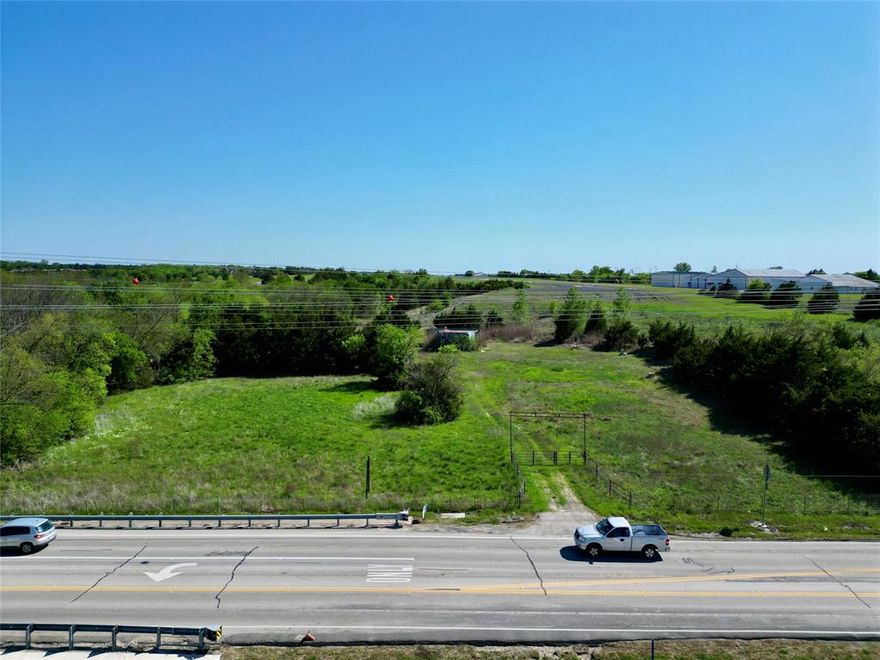 **Prime Two-Acre Lot in Rockwall with Highway 66 Frontage**  
This undeveloped two-acre property offers excellent visibility and access right on Highway 66, with the added benefit of backing up to the Rockwall Airport runway. The front portion of the lot lies within the 100-year floodplain. Zoned for Single Family Residential (SFR) with an Agricultural Overlay, this versatile parcel is perfect for a variety of uses, including a landscaping business, grazing, or other agricultural ventures. Take advantage of this unique opportunity to develop a property in a growing area!