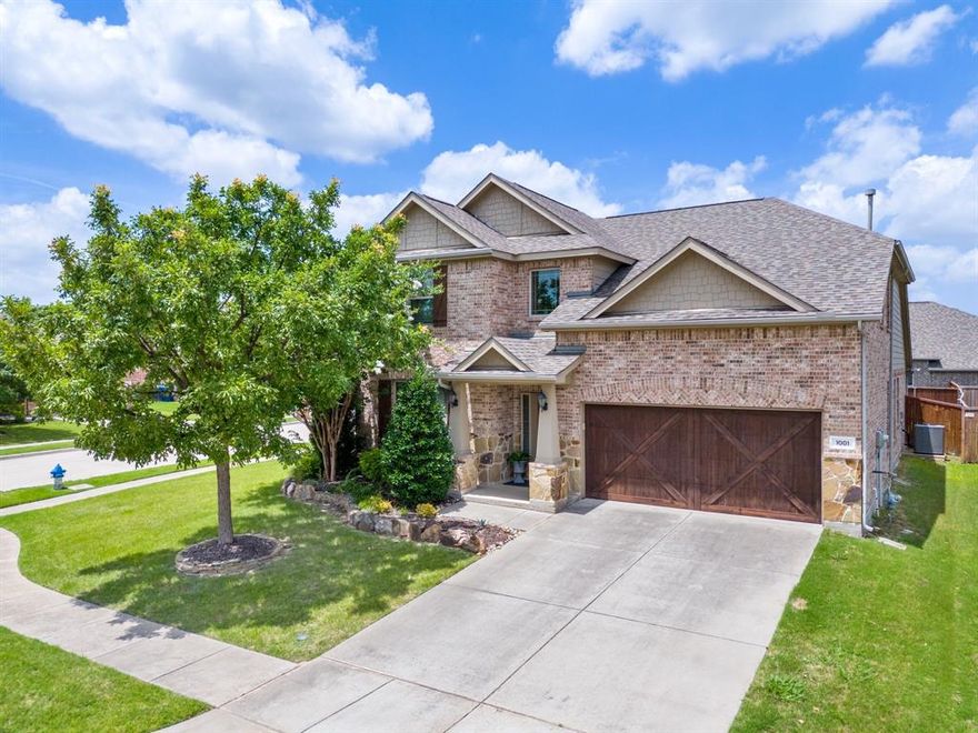 This inviting home sits on a corner lot in a quiet cul-de-sac within McKinney’s sought-after Inwood Hills community. Step inside to a two-story foyer and immediately notice the striking dining area, where a statement chandelier, designer wallpaper, and an accent ceiling create an impressive and welcoming first impression. The kitchen is designed for both daily living and entertaining, with granite countertops, a tile backsplash, stainless steel appliances, a gas stove, and a large island with breakfast bar seating. It opens seamlessly to the living room, which features a fireplace and large windows overlooking the backyard. The adjacent breakfast nook offers easy access to the outdoor spaces. Thoughtful details, such as crown molding and arched doorways, add elegance throughout the home. The main floor includes a guest bedroom with a full bathroom, perfect for visitors or as a home office. The primary suite is set apart for privacy, and the ensuite features dual vanities, a soaking tub, a separate shower, and a spacious closet. Upstairs, you’ll find a spacious game room with built-in window seats, a media room, and a half bath- ideal for family gatherings or entertaining. Two additional bedrooms share a bathroom. Outside, the backyard is designed for relaxation and entertaining. A stone patio with a rock fire pit creates a natural gathering space, while a covered patio and grass offer options for both shade and play. Living in Inwood Hills means access to a community pool, walking paths, and a playground. The home is close to Bonnie Wenk Park and El Dorado Country Club, featuring an 18-hole golf course and a variety of amenities.