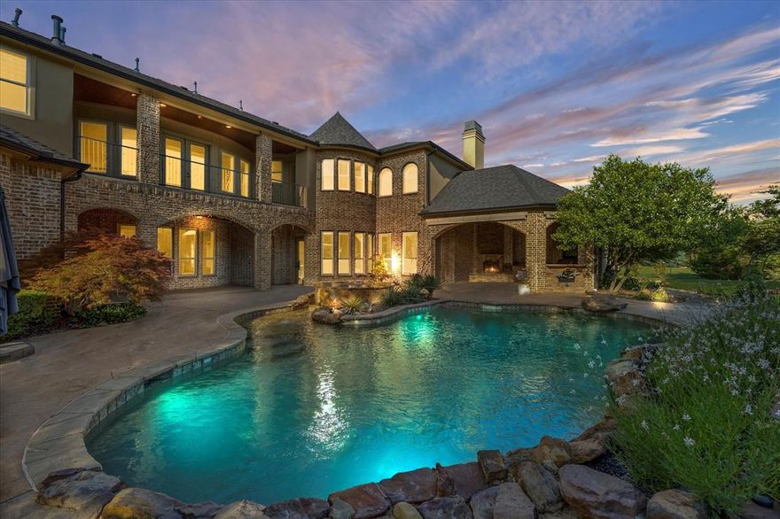 Nestled within a prestigious executive-style gated community, this meticulously crafted 5-bedroom estate offers unparalleled luxury and privacy. A grand two-story office with a hidden door and spiral staircase leads to an upstairs library and exercise room, seamlessly blending functionality and elegance. The open-concept floor plan is adorned with rich hardwood floors throughout, creating a warm and inviting atmosphere. The chef’s kitchen is a culinary masterpiece, featuring top-tier appliances and custom cabinetry, perfect for both everyday meals and grand entertaining. Adjacent to the kitchen, a spacious great room and formal dining area provide ideal spaces for both intimate gatherings and grand entertaining. The main level also boasts a private guest suite, offering comfort and seclusion for visitors. Upstairs, a fully furnished theater room awaits, providing an immersive cinematic experience, while a thoughtfully designed kids' retreat offers a dedicated space for play and creativity. Outside, the resort-style backyard is a true oasis, complete with a large saltwater pool and spa, extensive landscaping, an inground trampoline, and a sport court. Multiple outdoor living areas, including a fully equipped outdoor kitchen welcome year-round enjoyment. The estate is further complemented by a 4-car garage, providing ample space for vehicles and storage.