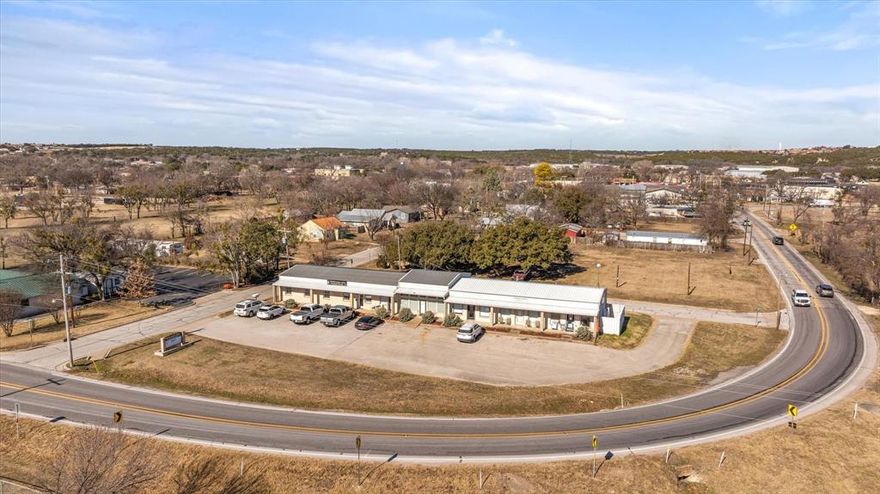 Income producing Opportunity.  This property has 6 office and retail suites all tenant occupied.  Property is well maintained with excellent road frontage exposure with high traffic counts.  Excellent curb appeal.  Centrally located on FM 144 Route with close proximity to Highway 67 as well as Downtown Square, Medical District, Central Business District, Tourist Sites, churches as well as surrounded by residential.  Glen Rose is growing in all the right ways.  If you are looking for a great income producing investment this is it!  All suite are individually metered for electric.  Tenant's pay trash and participate in a shared water bill.  Suite A is equipped with a industrial component with a grade level roll up door.  Suite C has an upstairs loft which theoretically gives you more square footage.