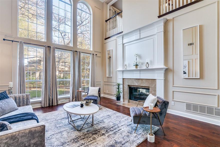 Stunning true custom home built by Anthony Custom Homes, nestled in a heavily treed and mature neighborhood. Step inside to soaring ceilings, abundant natural light, and exceptional craftsmanship throughout. The home features freshly painted kitchen cabinets and brand new carpet, creating a bright, updated, and move in ready feel.
Enjoy two spacious living rooms on the main level, each with its own fireplace, built in cabinetry, and beautifully integrated shelving, perfect for entertaining or everyday living.
The gourmet kitchen offers a new cooktop, double ovens, granite countertops, a center island, and a peninsula bar with additional seating, ideal for both meal prep and gathering.
Retreat to the expansive primary suite, complete with a separate sitting area featuring a fireplace and access to a private enclosed screened in balcony, a peaceful spot to unwind. With two bedrooms downstairs and two bedrooms upstairs, the layout provides excellent flexibility for guests, multigenerational living, office space, or hobbies.
The fully renovated downstairs bathroom includes a walk in shower, custom cabinetry, and designer finishes.  The spacious garage is also already equipped with an EV charger for current or future ownership of electric vehicles!
A perfect blend of custom quality, thoughtful design, and modern updates, this home is truly one of a kind.