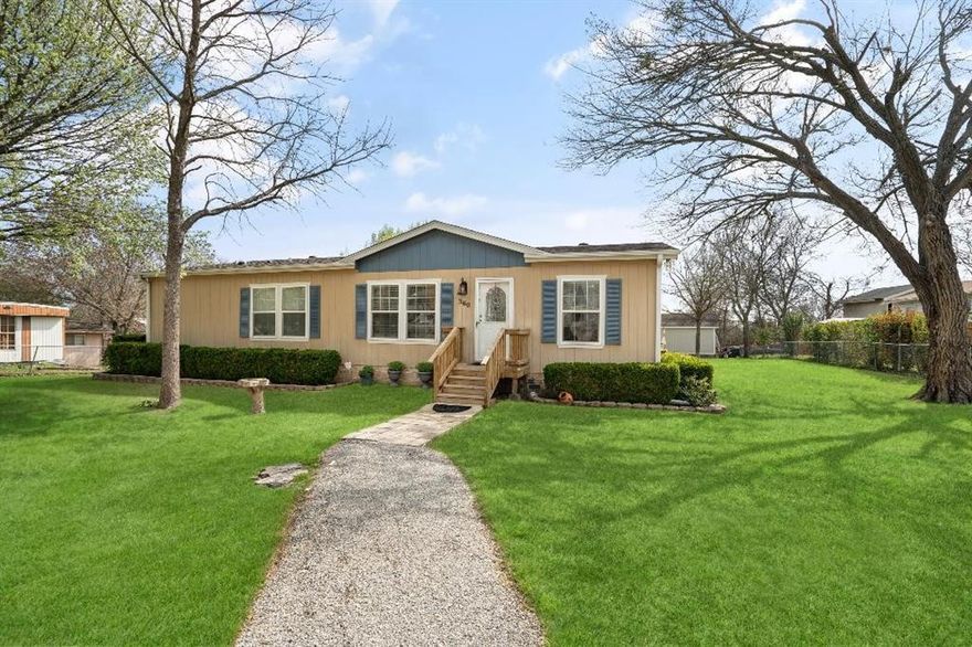 Beautiful modular home built in 2010 with wonderful amenities located on a lot just under .75 acre and surrounded by beautiful trees.  Multi car parking available out front or in back garage storage building.  There is also a storage shed on the property approximately 10' X 20'
Property can be entered from front or back.
Country living but just minutes away from major roadways.