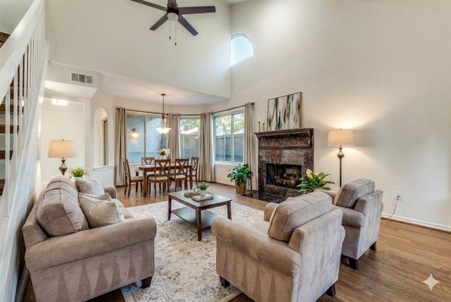 Beautifully refreshed and designed for effortless living, this 2-bed, 2-bath condo blends style and convenience within a gated community featuring a pool. The main level showcases refinished hardwoods, fresh paint, upgraded light fixtures and fans, and an elegantly updated kitchen with new tile, counters, and sink. The sunlit living room with fireplace opens to a private patio, creating a seamless indoor–outdoor experience. Both bedrooms offer the opportunity to serve as the primary suite—choose the first-floor option for easy access or the upstairs retreat for added privacy, complete with updated bath finishes, a private balcony, and a loft ideal for an office, fitness space, or lounge. With exterior maintenance handled by the community and unbeatable access to premier dining, shopping, and major thoroughfares, this lock-and-leave residence delivers low-maintenance luxury in a prime location.