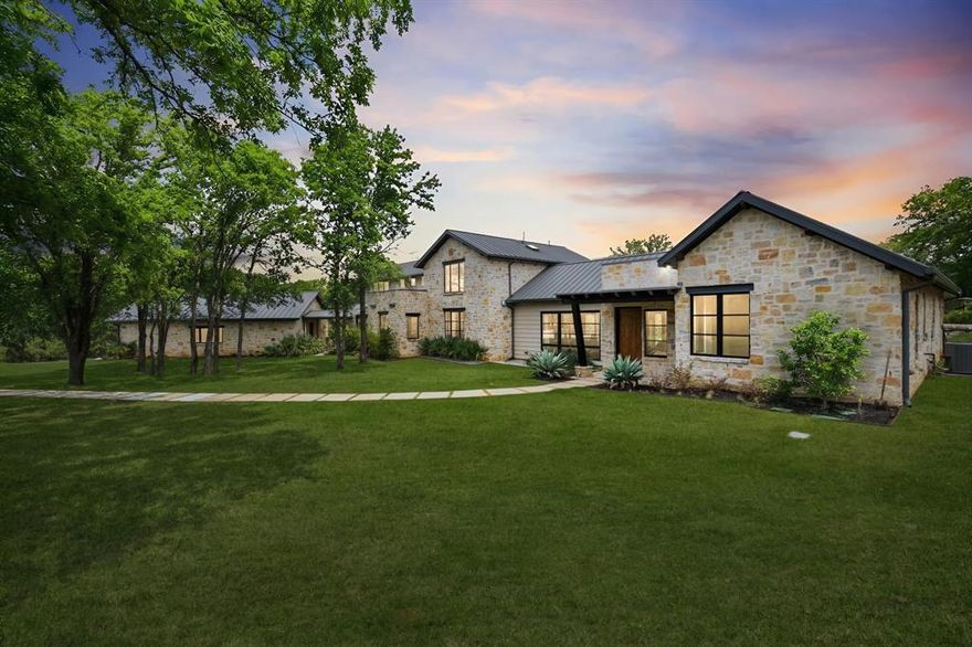 First time to market, this custom estate built by Kenneth Graham Custom Homes is located in the Country Oak Estates addition of Hickory Creek, Texas within Lake Dallas ISD and sits on approximately 2.5 acres with no HOA.

The main level offers a highly functional layout designed for everyday living and entertaining. Downstairs includes the primary suite with double walk-in closets and private stone courtyard access, an additional bedroom with full en-suite bathroom, a dedicated study, second office or flex space, open living area with stone fireplace and magnetic feature wall, dining area, and a chef’s kitchen. The kitchen features Patagonia stone countertops, custom cabinetry with pull-out storage, walk-in pantry with built-ins, and a full Thermador appliance package including a 48-inch gas cooktop, 30-inch refrigerator, 30-inch freezer, and dishwasher. Additional main level features include polished concrete floors, white oak flooring in the entry and primary suite, laundry room with mud bench and sink, leathered granite countertops in the laundry, pool bath, and a 3-car garage.

The second floor includes two bedrooms, two full bathrooms, and an additional living area, along with two second-story patios overlooking the front and back of the property, providing elevated views of the surrounding acreage.

Outdoor features include a saltwater pool, artificial turf, irrigation system, additional parking in the front and rear of the property, posted fencing, and a private tree-lined drive providing privacy from the road. Additional improvements include a carbon filtration system and custom window shades.

Country Oak Estates offers an acreage setting in Hickory Creek with convenient access to Lake Lewisville, I-35E, Denton, and surrounding North Texas communities.