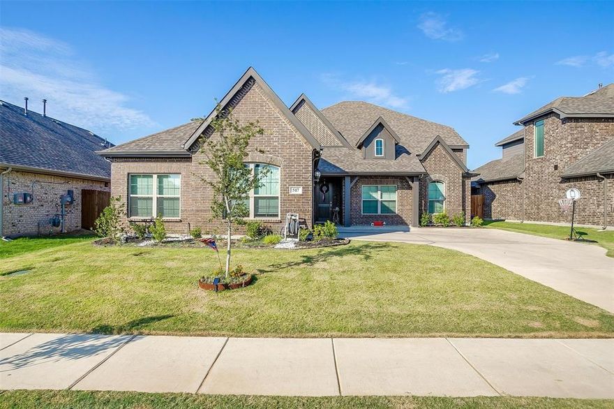 Welcome to this beautifully upgraded 4-bedroom traditional home in the desirable Panchasarp Farms community of Burleson — offering modern smart-home features and flexible living spaces on a premium homesite. Enjoy rare backyard privacy and open views with no homes behind, a standout feature in this growing community and not typically available with new construction. Designed for today’s lifestyles, the spacious floor plan is ideal for multi-generational living, featuring a guest suite on the main level, multiple living areas, and a dedicated study perfect for remote work or quiet retreat. The inviting living room centers around a cozy fireplace, creating a warm gathering space for family and friends. A gourmet kitchen showcases a large island, coffee bar, custom cabinetry, granite countertops, stainless steel appliances, 5-burner gas range and a generous walk-in pantry — perfectly suited for entertaining or everyday living. Builder-upgraded luxury vinyl flooring adds both durability and style to the primary living areas. Technology enhancements include electric vehicle charging plugs in the garage, full pre-wiring for security cameras, and an installed (owned) whole-home security system for added peace of mind. Outdoor living is elevated with permanent exterior lighting, a gas connection on the covered back porch for grilling, and a dedicated gas connection behind the oven for future conversion. The private backyard also features a SMART Wyze sprinkler system and landscape lighting circuit — ideal for creating a relaxing evening atmosphere. Adding long-term value, Joshua ISD has broken ground on a new $53 million elementary school scheduled to open in August 2026, supporting strong community growth. With thoughtful upgrades, flexible living spaces, and enhanced privacy, this move-in-ready home offers an exceptional opportunity in one of Burleson’s most desirable neighborhoods.