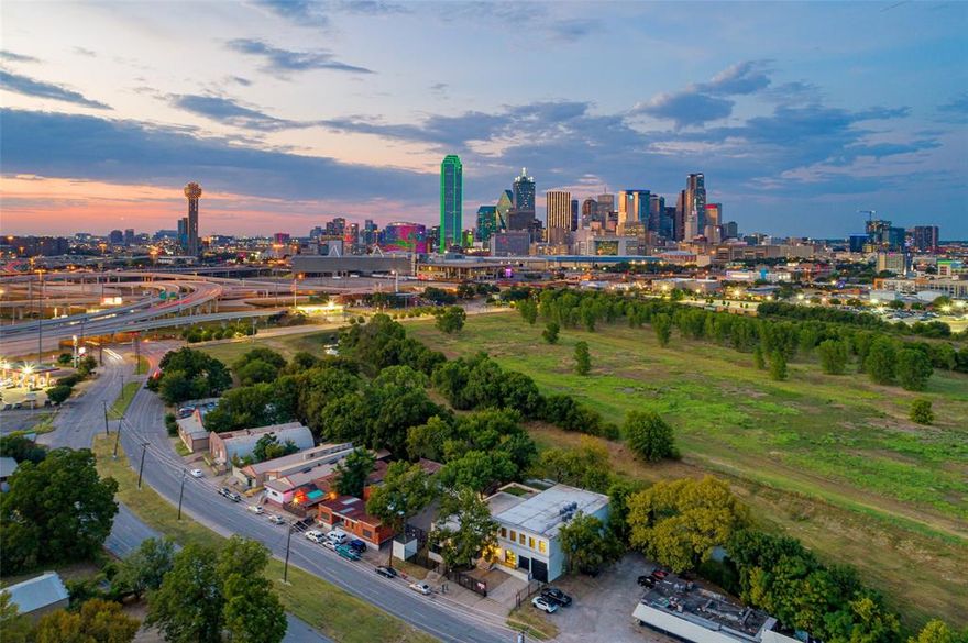 One of a kind commercial assemblage in the Design District that includes 4 buildings with 16,952 combined SF on .48 acres with 180’ frontage & two gated parking lots. This exceptional development backs downtown Dallas with unobstructed stunning skyline views & views of a new $50M, 17 acre city park in progress called the Dallas Water Commons that will protect & enhance the city views. 1212 S. Riverfront Blvd. features 2 extraordinary buildings with 12,164 SF renovated to perfection 2019 with upscale commercial grade finishes while keeping the historic character of the buildings with exposed brick walls, vaulted open rafter ceilings, walls of warehouse windows throughout. Open floor plans with numerous offices, flex space, 3 kitchens, 7 bathrooms, sound proof recording studio, outdoor balcony + a 4100 roof deck with incredible city & park views, attached 2 car garage with a large raised loading dock & hydraulic lift to the 2nd level. New TPO roof, 6 Carrier HVAC systems, tankless hot water, new electrical & plumbing, wired for remote shades & music. Full laundry.  1208 S. Riverfront has 10575 SF parking lot with a 1500 SF brick storefront office & a 3288 SF warehouse garage with 6 dock doors & vaulted ceilings.  Zoning allows 270 Foot Height with No side or rear set backs! New developments in progress near by include the $3.7 Billion Dallas Convention Center renovation & expansion, Hunt $5 billion Reunion Tower Renovation, Columbus Realty 47 acre mixed use project at 505 N. Riverfront Blvd., Texas Central Bullet Train, Longhorn Ballroom 6,000 seat amphitheater.  Other Purchase Options:1208 & 1212 S. Riverfront #101 (3 Buildings With 8906 SF on .35 Acres) $2.590M. Or 1212 S. Riverfront Blvd. 102 (2-story 8,046 SF) $2.995M.