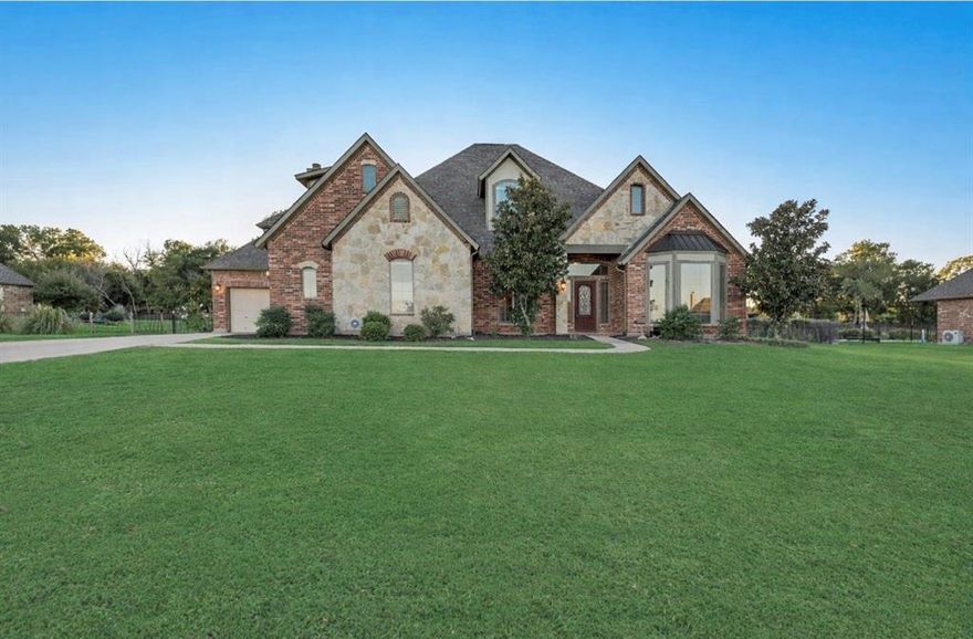 Discover luxury and tranquility in this custom-built home, located in the exclusive gated community of Rose Creek Estates. Situated on a beautiful 1-acre lot, this home blends elegance with comfort and functionality. Step inside to soaring ceilings, a grand staircase, and rich hardwood floors that lead to a sunlit study and formal dining room. Fresh interior paint and brand-new carpet throughout give the home a crisp, move-in-ready feel. The spacious living area showcases a dramatic floor-to-ceiling stone fireplace and offers serene views of the backyard. The gourmet kitchen is a chef’s dream with stainless steel appliances, granite countertops, ample cabinetry, and a cozy breakfast nook. The main-floor primary suite provides a private retreat with direct patio access and a spa-inspired bath with oversized shower, soaking tub, dual sinks, & large walk in closet with built ins. Upstairs features generously sized bedrooms along with a media room and game room, perfect for entertaining or relaxing. Step outside to your own outdoor oasis with a covered patio and beautifully landscaped yard—ideal for gatherings and quiet evenings alike.