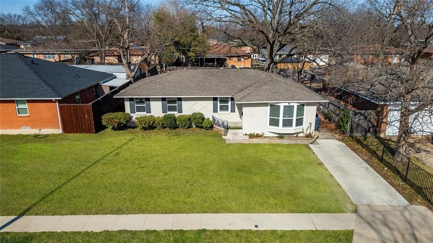 Welcome home to this charming brick residence that perfectly blends comfort with contemporary updates in this delightful and established neighborhood. This 3-bedroom, 2-full bath home offers over 1,500 square feet of thoughtfully designed living space, offering the ideal canvas for your next chapter.

Step inside and immediately appreciate the open concept layout that seamlessly connects the living, kitchen & dining rooms, creating an inviting atmosphere perfect for both everyday living and entertaining guests. The updated kitchen features an island that serves double duty as your culinary command center and a casual gathering spot for morning coffee or evening conversations.

Modern updates abound throughout this move-in-ready gem. Fresh paint adorns the walls, new flooring flows underfoot, and replacement windows flood the interior with natural light while keeping energy costs in check. The bathrooms have received thoughtful renovations, including a refreshing walk-in shower that transforms your daily routine into a spa-like experience.

This home offers the perfect blend of updated amenities and welcoming charm.

Location enhances the appeal even further. Students have convenient access to W. W. Samuell High School just moments away, while J. P. Hawn Park provides nearby green space for weekend recreation. Public transportation options, including the Buckner Station, make commuting a breeze.

This opportunity won't last long. Schedule your tour today and discover why this beautifully updated home deserves to be your next address.