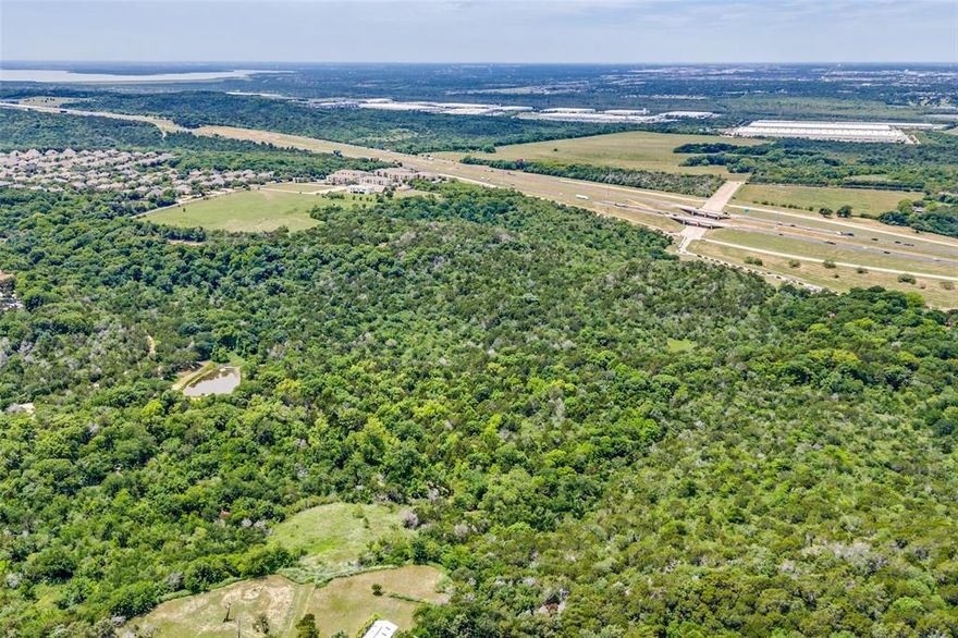 Exceptional 12.5-acre unimproved tract ideally positioned near a major freeway with excellent location within the Dallas-Fort Worth metroplex. Commercially zoned and currently benefiting from an AG exemption, this versatile property presents outstanding potential for future development, investment, or long-term hold strategies. Conveniently located just 20 minutes from Downtown Dallas, DFW International Airport, and Love Field Airport, the property offers a strategic location for commercial, industrial, mixed-use, or business-related opportunities. Whether you're planning immediate development or securing land in a rapidly growing corridor, this property combines location and investment potential in one exceptional offering. Property is land locked, 30 acres west of the property is for sale by a different owner MLS #21163398.