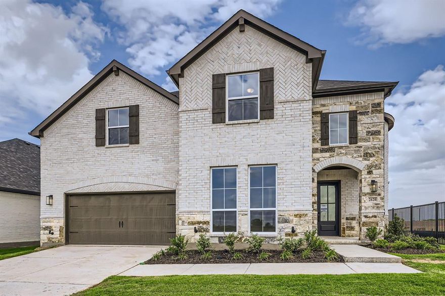 This home has plenty of curb appeal with a gorgeous combination of brick and stone along with cedar accent shutters. The foyer of this home will take your breath away with the elegant spiral staircase, which is further enhanced with natural light from the windows nearby. The study is generously sized at 12 ft x 15 ft providing enough room for two people working from home or it could serve as a quiet location for homework. Situated off  the 3-car tandem garage is a convenient mud room, a powder bath and a sizable utility room with plenty of space for a washer, dryer and more. The family room features a cozy fireplace and overlooks the chef's kitchen boasting a large working island with additional seating, a corner walk-in pantry and a butler's pantry that provides easy access to the formal dining room. The main bedroom is the perfect retreat with a bay window and elegant dual doors into the main bath which offers split vanities and a spacious walk-in closet. Upstairs, there’s two additional bedrooms, two full baths, a spacious game room and a media room. Rounding out the plan is a 3-car garage and a fabulous outdoor living space, perfect for year round entertaining. Our designers have chosen the most incredible quartz, wood and tiles to finish this home out!
