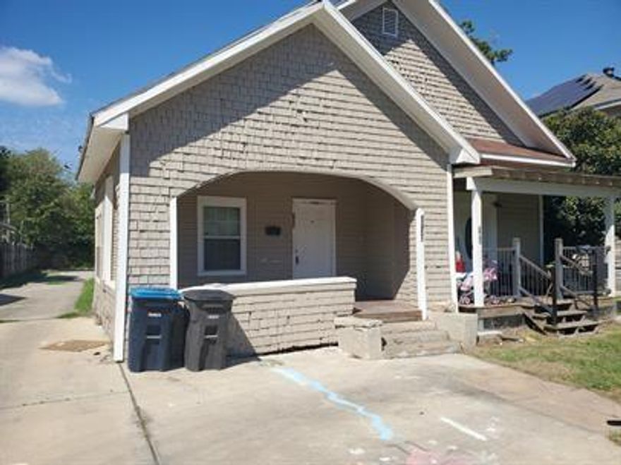Half duplex with washer and dryer connections and a small back fenced in patio. Tile floors.