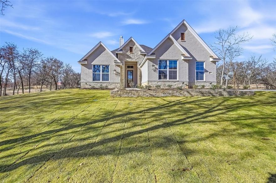 Check out this beautifully designed Kenmark Home situated on a serene 2-acre treed lot in the sought after Escondido Ranches community. This property offers the space, privacy, and functionality you've been dreaming of with convenient access to downtown Weatherford.  Step inside to find a welcoming layout that caters to both functionality and entertaining. A dedicated study at the front of the home provides the perfect space for a home office, library, or flex area to suit your needs. The open-concept living area is bright and inviting, with a 12' Pella slider door that frames views of the surrounding trees and pond. Step outside onto the covered patio, where you can enjoy hosting gatherings, relaxing with a morning coffee, or simply taking in the surroundings. This is the VERY LAST home in the very sought after Escondido Ranches, don't miss out on your chance to own a brand new home in this community!