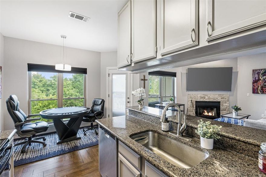 *This UPDATED CONDO, in the Heart of the Popular LAKE HIGHLANDS, is a Rare 2nd-Story Unit w-BOTH an Incredible View AND a 1-Car Garage! NOW...just $143k PLUS Seller is offering $3k toward Buyer Closing Costs or Rate Buy-Down! Nestled in Nature, Overlooking a Beautiful Treed Creek w-Grassy Landscape...Enjoy your morning coffee, listening to the birds sing from your exterior balcony! Living Room has a Lovely Stone-Framed Wood-Burning Fireplace w-TV Mount Above FP*Updated Lighting, Ceiling Fans & Fixtures*Sleek Granite Kitchen Countertops & Breakfast Bar, Additional Cabinetry offering Generous Storage Space*Stylish Wood-Look Ceramic Tile Flooring laid in an Elegant Herringbone Pattern throughout the Home*Newer Windows, Window Treatments, Patio Door, Dishwasher*2025 updates include Hot Water Heater, New Toilet, New Garbage Disposal! *Full-sized WD Utility Area off the Kitchen! Plenty of Windows Provide Lots of Natural Interior Light! No Water Bill...HOA includes Water & Trash! Oaks On The Bend Condos offer a Community Pool and are Conveniently Located Close to Nearby Shopping, Dining, White Rock Lake Park & Trails! Easy Access to DART Transit or Short Drive to Northpark Mall or Vibrant Uptown Dallas area! *Award-Winning Richardson ISD School District and White Rock Elementary School - one of the Highest-Rated Elementary Schools in Dallas! Vacant & Move-In Ready! Note: Condos ARE approved for 100% VA or Conventional Financing with 10% down!