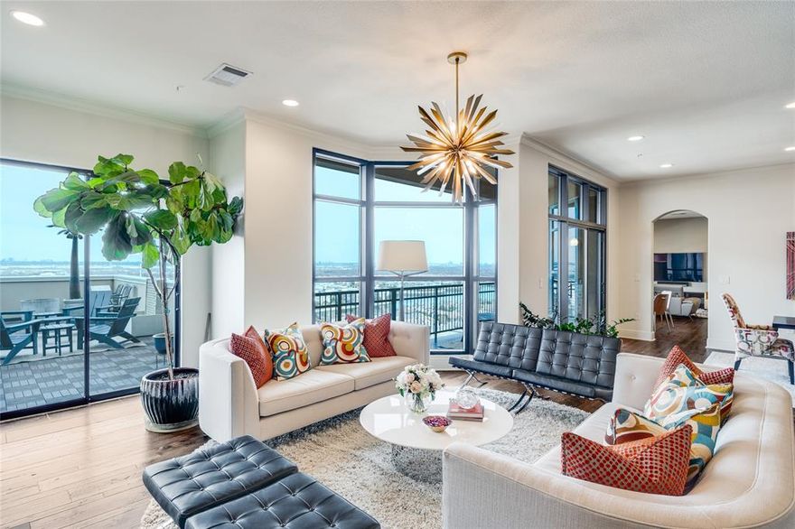 This 15th-floor penthouse at Grand Treviso offers elevated views over the Las Colinas waterways and features no shared walls, providing a high level of privacy. The open layout includes hardwood and designer flooring, custom lighting, and a spacious living and dining area with large east-facing windows that bring in natural light. The kitchen is equipped with KitchenAid appliances, an induction cooktop, double ovens, a breakfast bar, and a dry bar for additional serving space. The home includes 2 bedrooms and 2.5 remodeled bathrooms. Each bedroom features a private study or sitting area, offering flexibility for work or relaxation. Outdoor living includes more than 700 square feet of private terrace space, with a main terrace that includes a grilling station and water feature. Additional highlights include 2 premium parking spaces with EV charging and a private storage room on the third floor. Residents of Grand Treviso enjoy 24-hour concierge service, a fitness center, business and conference rooms, a clubroom, and a rooftop pool and spa overlooking Lake Carolyn. Conveniently located near the Las Colinas canals, dining, and entertainment, with easy access to DFW Airport and Love Field.