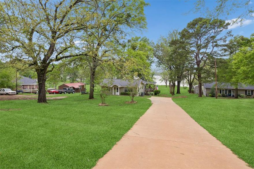 Welcome to this beautifully remodeled waterfront retreat on the tranquil shores of Lake Striker. Offering 4 bedrooms, 3 bathrooms, and approximately 1,936 square feet of thoughtfully designed living space, this home provides a peaceful setting ideal for both everyday comfort and relaxed entertaining. Inside, the home features a bright and open layout with stunning lake views that create a calming backdrop throughout the main living areas. The spacious kitchen offers abundant storage and preparation space, making it both functional and inviting. The primary bedroom serves as a quiet retreat, while three additional bedrooms provide flexibility for guests, workspace, or a variety of lifestyle needs. The outdoor setting truly highlights the property’s serene location. A covered deck offers a comfortable space to enjoy morning coffee at sunrise or unwind in the evening while taking in the peaceful water views. The level lot allows for easy access to the shoreline, perfect for fishing, boating, or simply enjoying the natural surroundings. The nearby fishing pier adds to the appeal for those who appreciate time by the water. Lake Striker is known for its calm, uncrowded waters, offering a quiet and relaxing environment. Located just minutes from the marina and within convenient reach of Henderson and Jacksonville, this property combines a tranquil lakefront lifestyle with access to everyday essentials. Additional features include reliable internet and cellular service, enhancing both comfort and connectivity. This is a rare opportunity to experience waterfront living in a peaceful, scenic setting.
