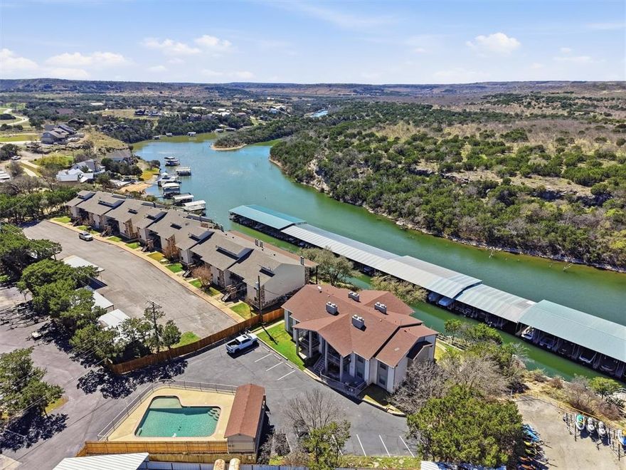 LOWEST PRICED WATER FRONT CONDO AT POSSUM KINGDOM LAKE!! Charming condo located within the highly sought-after Sportsman’s World community offering true lakefront living. This fully furnished 2-bedroom, 2-bathroom unit is the perfect lock-and-leave lake escape. Enjoy easy access to the water with the marina and boat docks just a short walk away. Whether you're looking for a weekend getaway, or low-maintenance lake retreat, this condo offers the ideal opportunity to experience everything Possum Kingdom Lake has to offer.