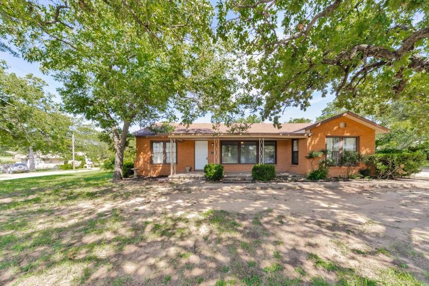 This Charming Red Brick Home is Full of Charm-It has lots of hardwood floors that stretch throughout the home in this 3-1 with CH-A. The living room features large open floor plans with plenty of natural light. With both a formal dining room and a breakfast nook, there's space for every kind of gathering. Thoughtful built-ins add extra storage and a touch of vintage charm. The home offers three comfortable bedrooms, one well appointed bathroom and a spacious office perfect for working from home or creative projects. Classic, inviting and full of personality-this home is ready to welcome you on its corner lot.